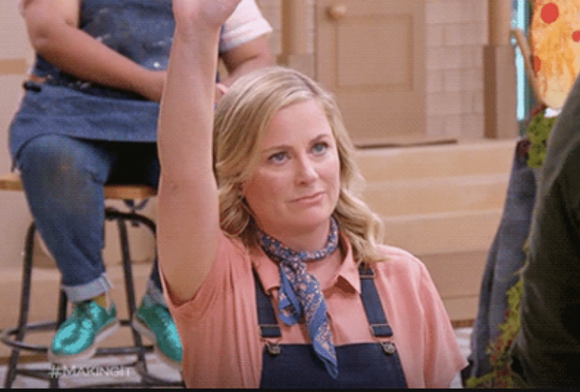 Amy Poehler raising her hand. Using it to talk about questions with video content