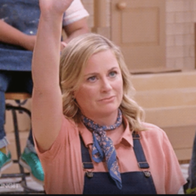 Amy Poehler raising her hand. Using it to talk about questions with video content